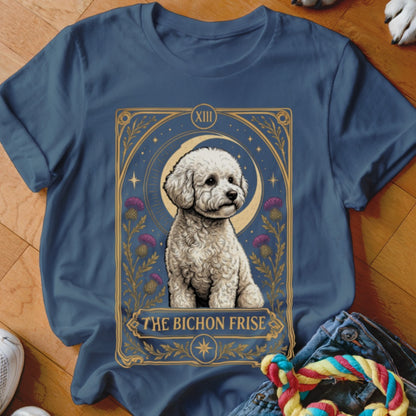 A blue t-shirt features a tarot-style graphic of a Bichon Frise with thistle flowers and a crescent moon.