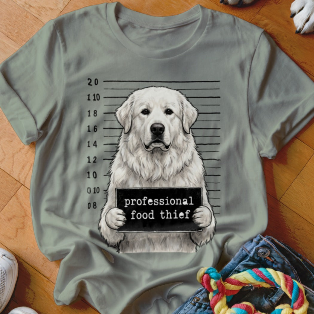 Great Pyrenees mugshot with "professional food thief" sign.
