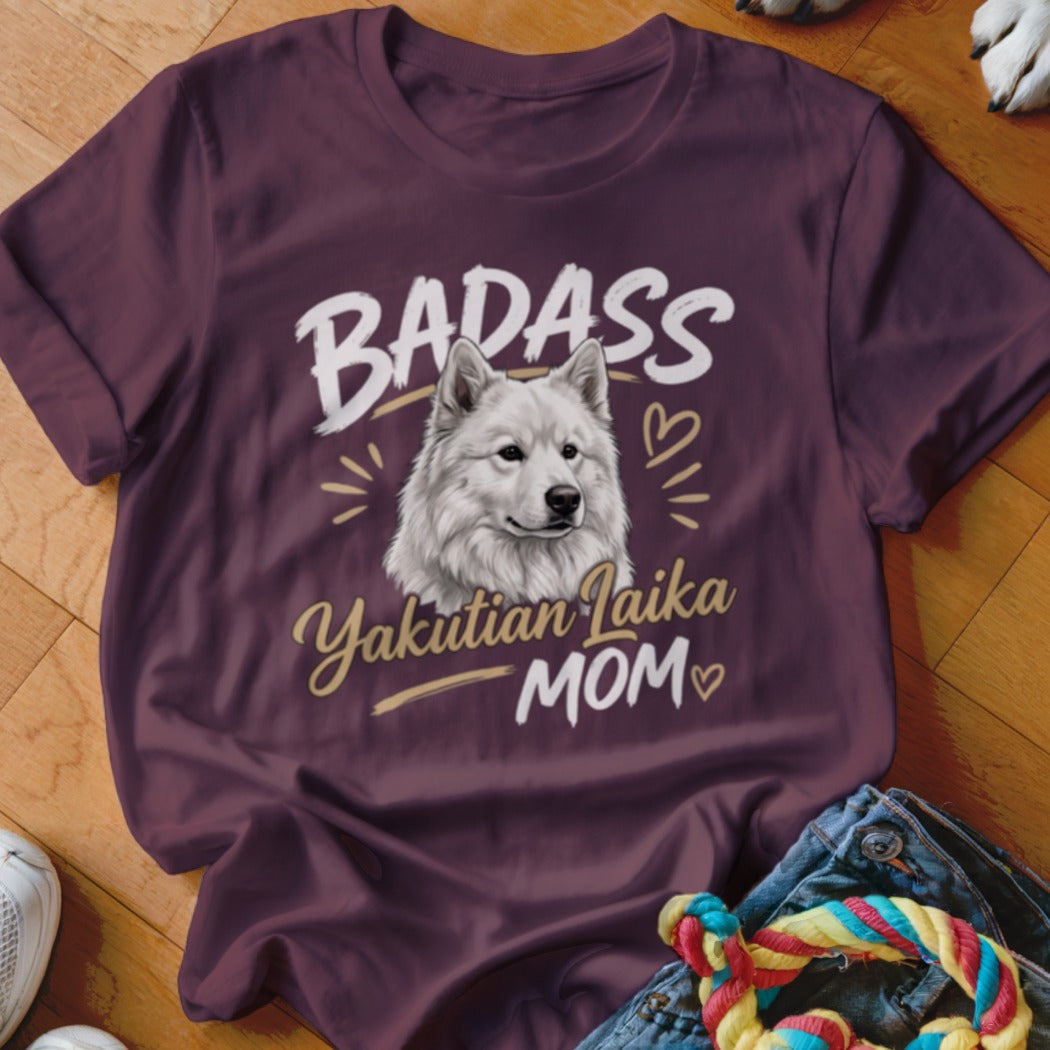 Maroon t-shirt featuring a graphic of a white Yakutian Laika dog and the text BADASS Yakutian Laika MOM.