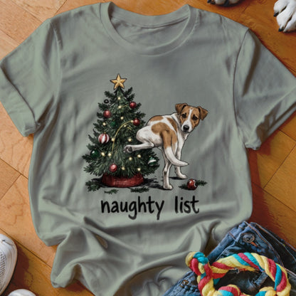 Dog lifting leg on Christmas tree with "naughty list" text below.