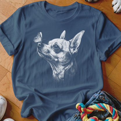 Blue crewneck t-shirt featuring a white sketch of a Chihuahua looking at a butterfly.