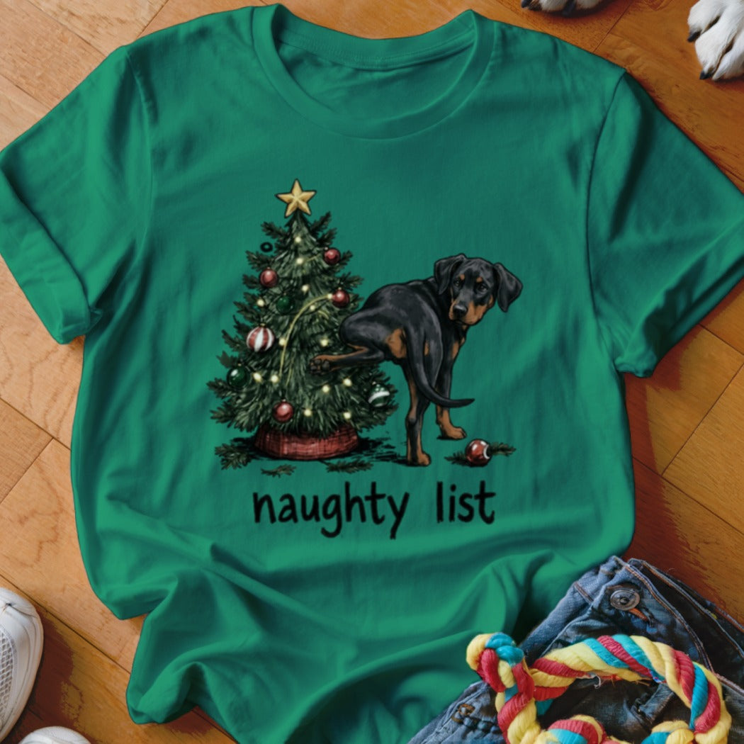 Rottweiler lifting leg on Christmas tree with "naughty list" text.