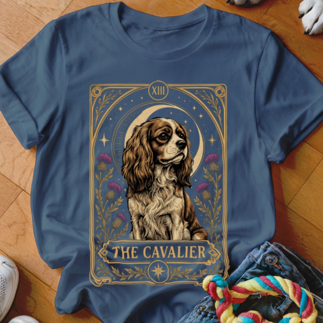 Slate blue t-shirt featuring a tarot card graphic of a Cavalier King Charles Spaniel.