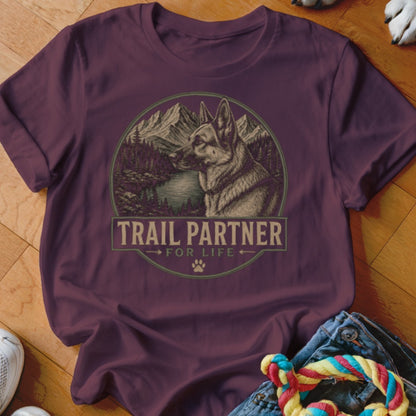 Maroon t-shirt with "TRAIL PARTNER FOR LIFE" text and German Shepherd in mountain landscape.