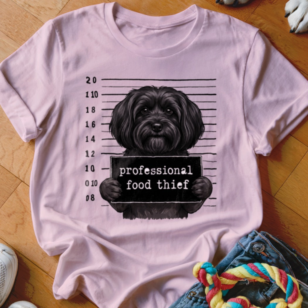 T-shirt with black dog mugshot holding "professional food thief" sign