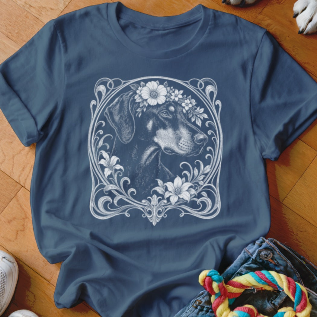 Doberman with flower crown illustration on a navy blue t-shirt.