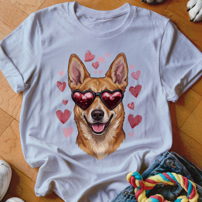 A white t-shirt features a graphic of a brown dog wearing heart-shaped sunglasses surrounded by pink hearts.