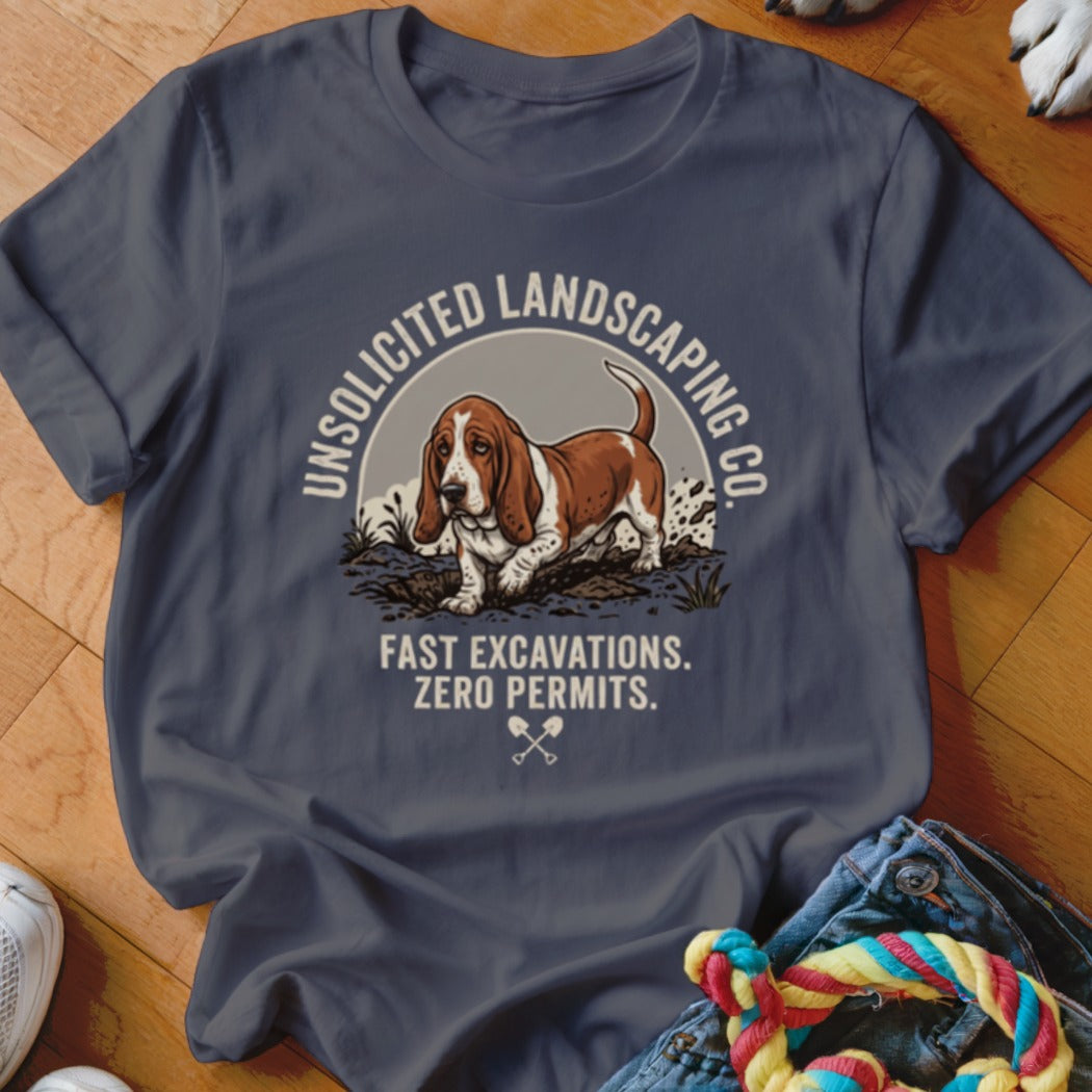 Basset hound on t-shirt with "Unsolicited Landscaping Co." text.