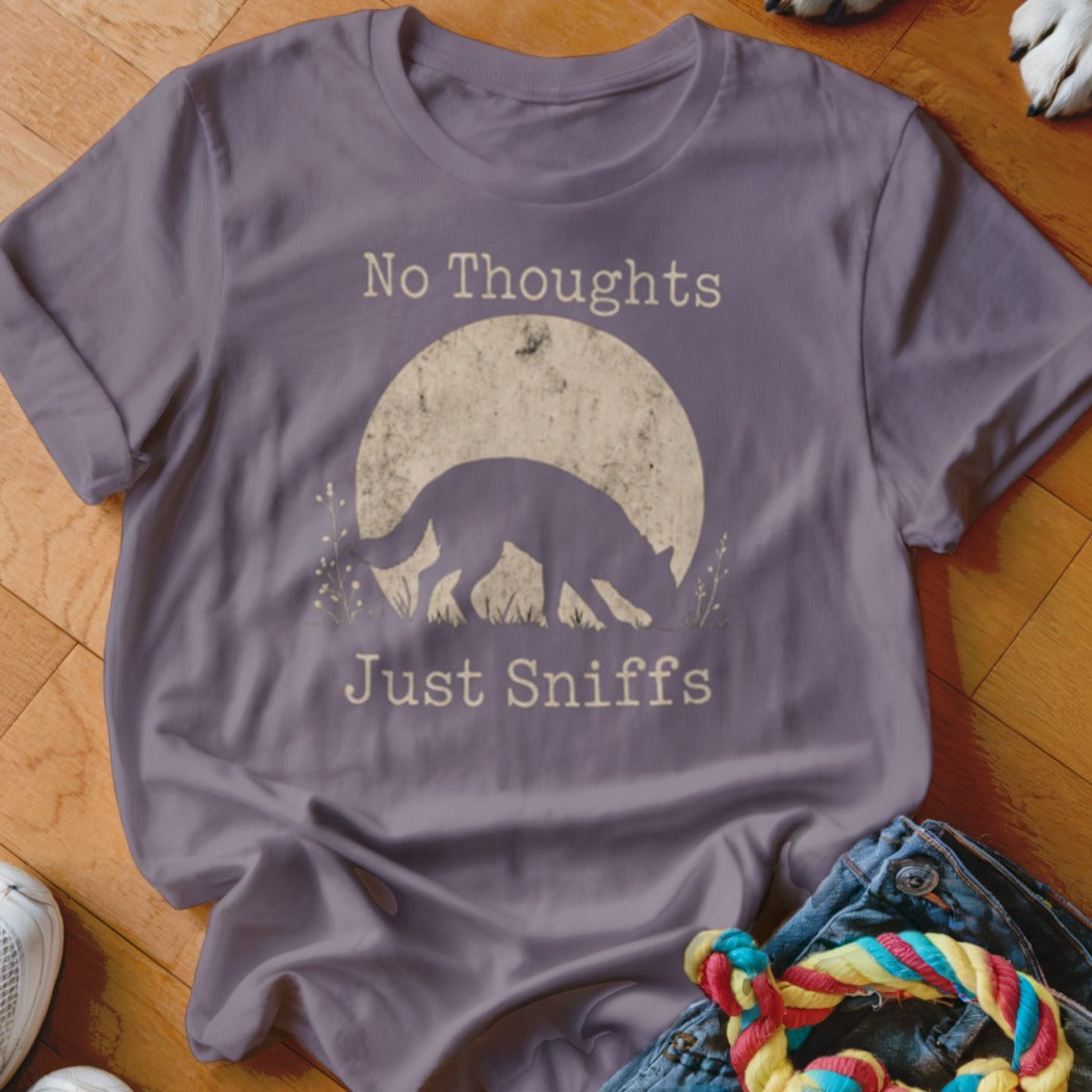 Purple t-shirt with distressed graphic of a dog sniffing under a moon with text "No Thoughts Just Sniffs".