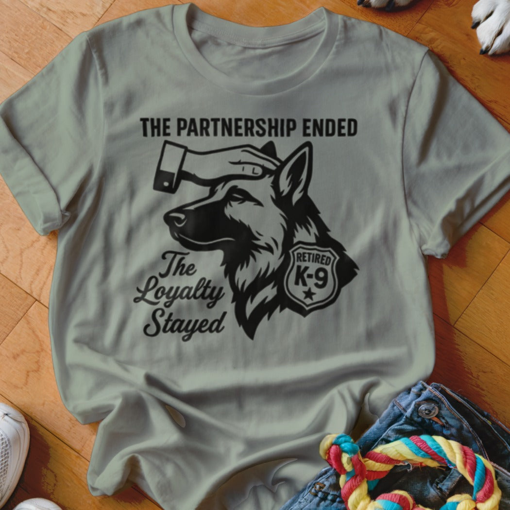 T-shirt graphic: German Shepherd with text "The Partnership Ended, The Loyalty Stayed," "Retired K-9".