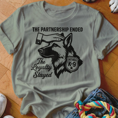 T-shirt graphic: German Shepherd with text "The Partnership Ended, The Loyalty Stayed," "Retired K-9".