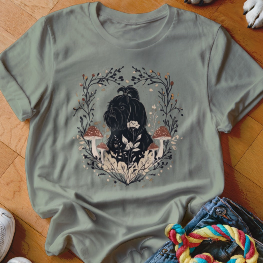 Sage green crewneck t-shirt featuring a graphic of a black dog surrounded by mushrooms and leaves.