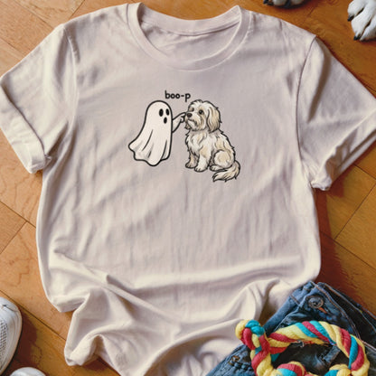 Cream t-shirt with a white ghost booping a small, fluffy dog.