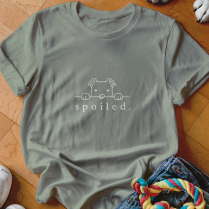 Sage t-shirt with a white line drawing of a dog peeking over text that reads "spoiled."