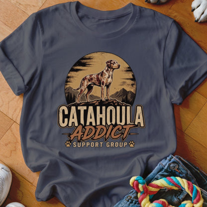 Dark gray t-shirt featuring a vintage graphic of a spotted dog and Catahoula Addict Support Group text.