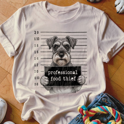 T-shirt graphic featuring a miniature schnauzer mugshot with text "professional food thief".