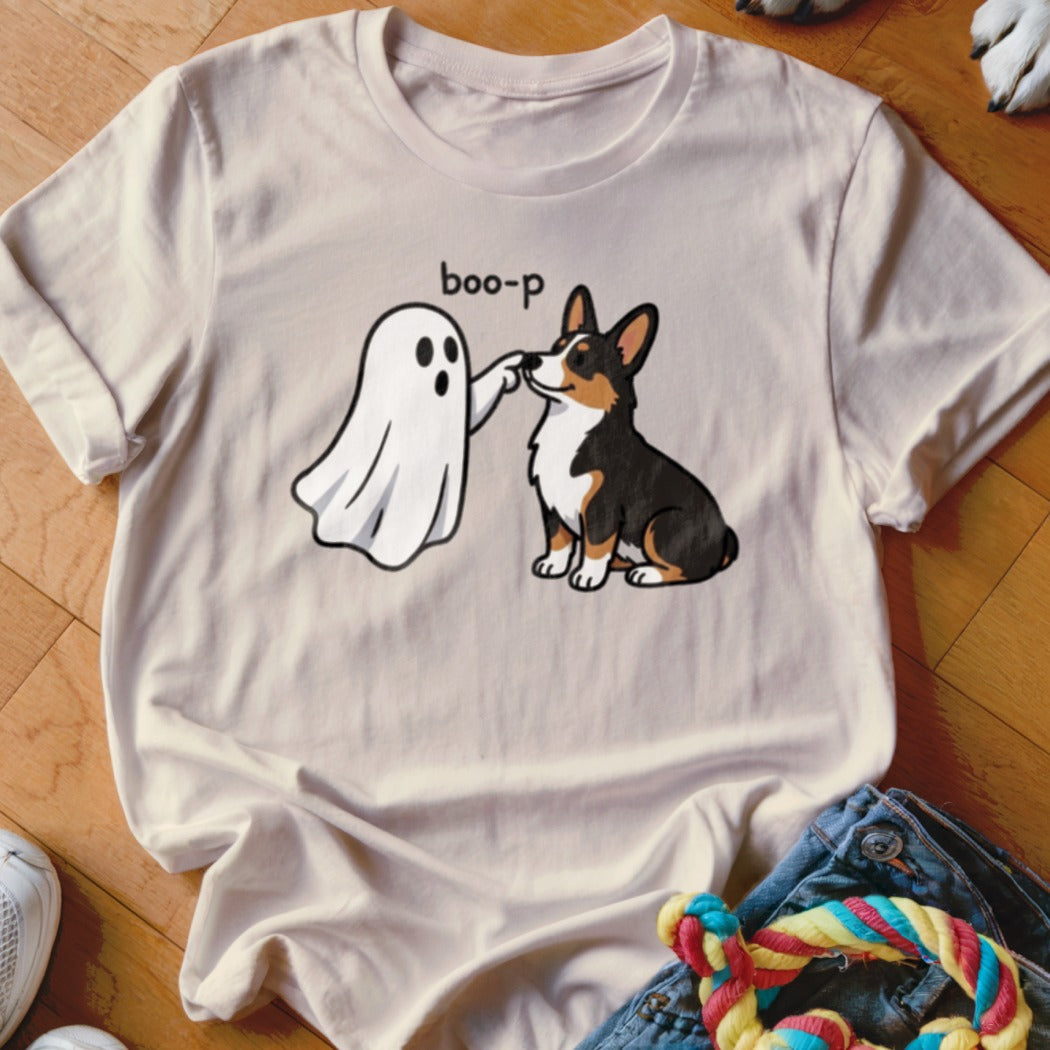 T-shirt with a cartoon ghost "booping" a corgi dog.