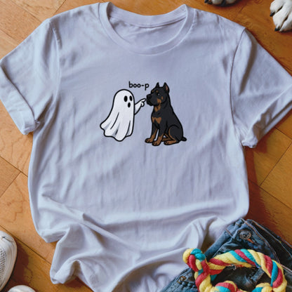 White t-shirt with cartoon ghost saying "boo-p" to a rottweiler dog.