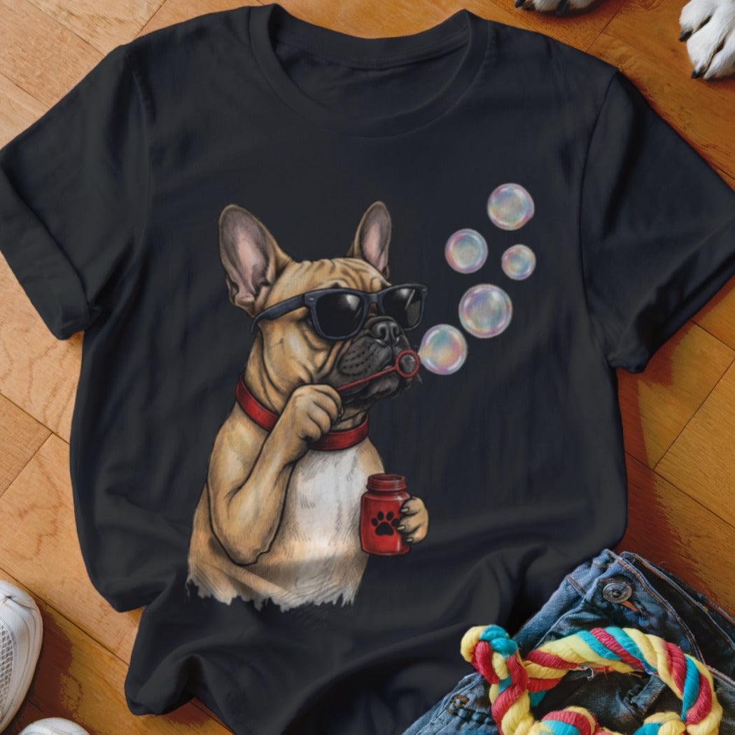 A black t-shirt featuring a graphic of a French bulldog wearing sunglasses and blowing bubbles.