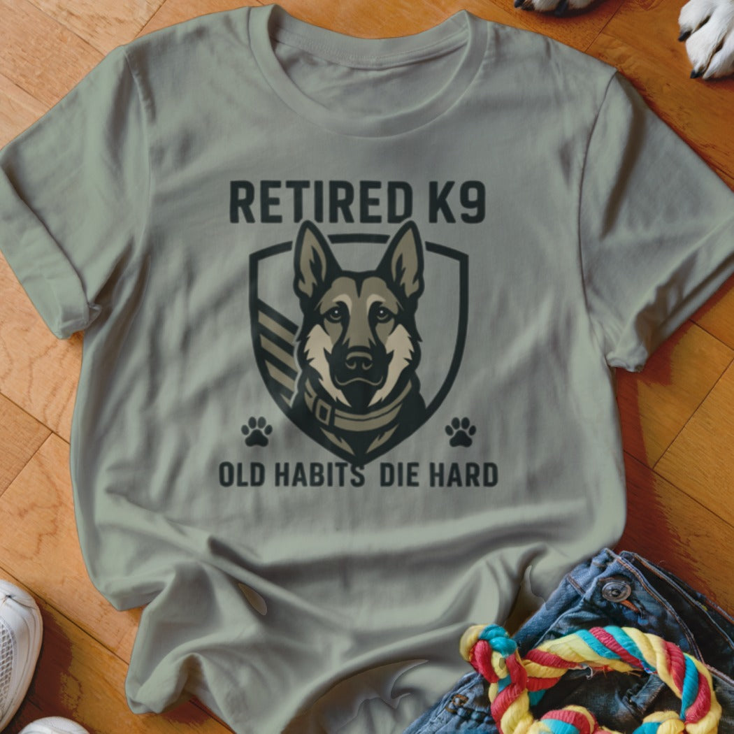 Gray t-shirt with "RETIRED K9 OLD HABITS DIE HARD" text and German Shepherd graphic.