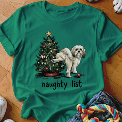 Green t-shirt with a Christmas tree and a dog raising its leg, text "naughty list".