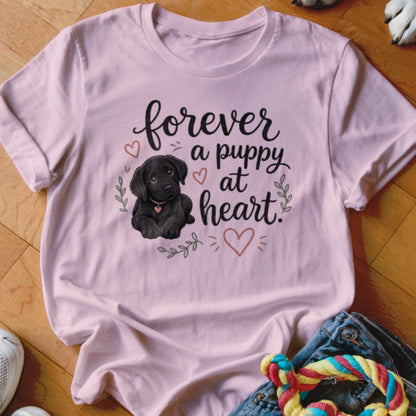 Pink t-shirt with black lab puppy art and text "forever a puppy at heart".
