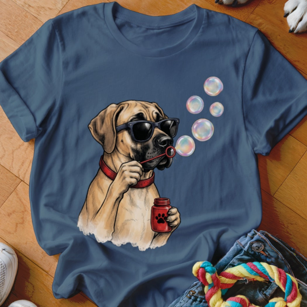 Blue t-shirt featuring an illustration of a dog wearing sunglasses and blowing soap bubbles.