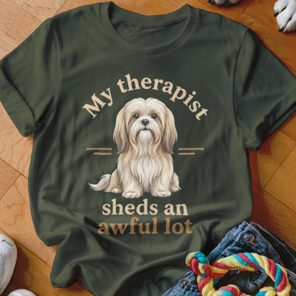Dark green t-shirt with "My therapist sheds an awful lot" and a fluffy dog graphic.