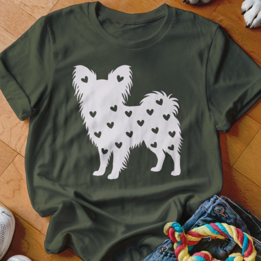 White dog silhouette filled with black hearts on a dark green t-shirt.