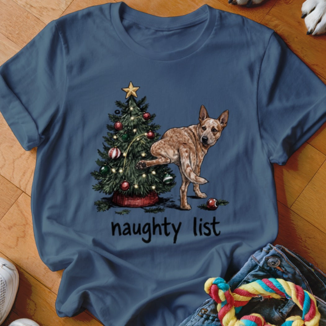 Red heeler dog by Christmas tree with text "naughty list"