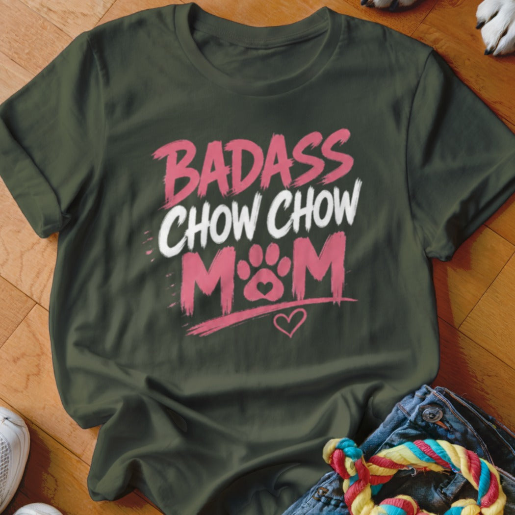Olive green t-shirt with pink and white text reading "BADASS CHOW CHOW MOM" and a paw print heart.
