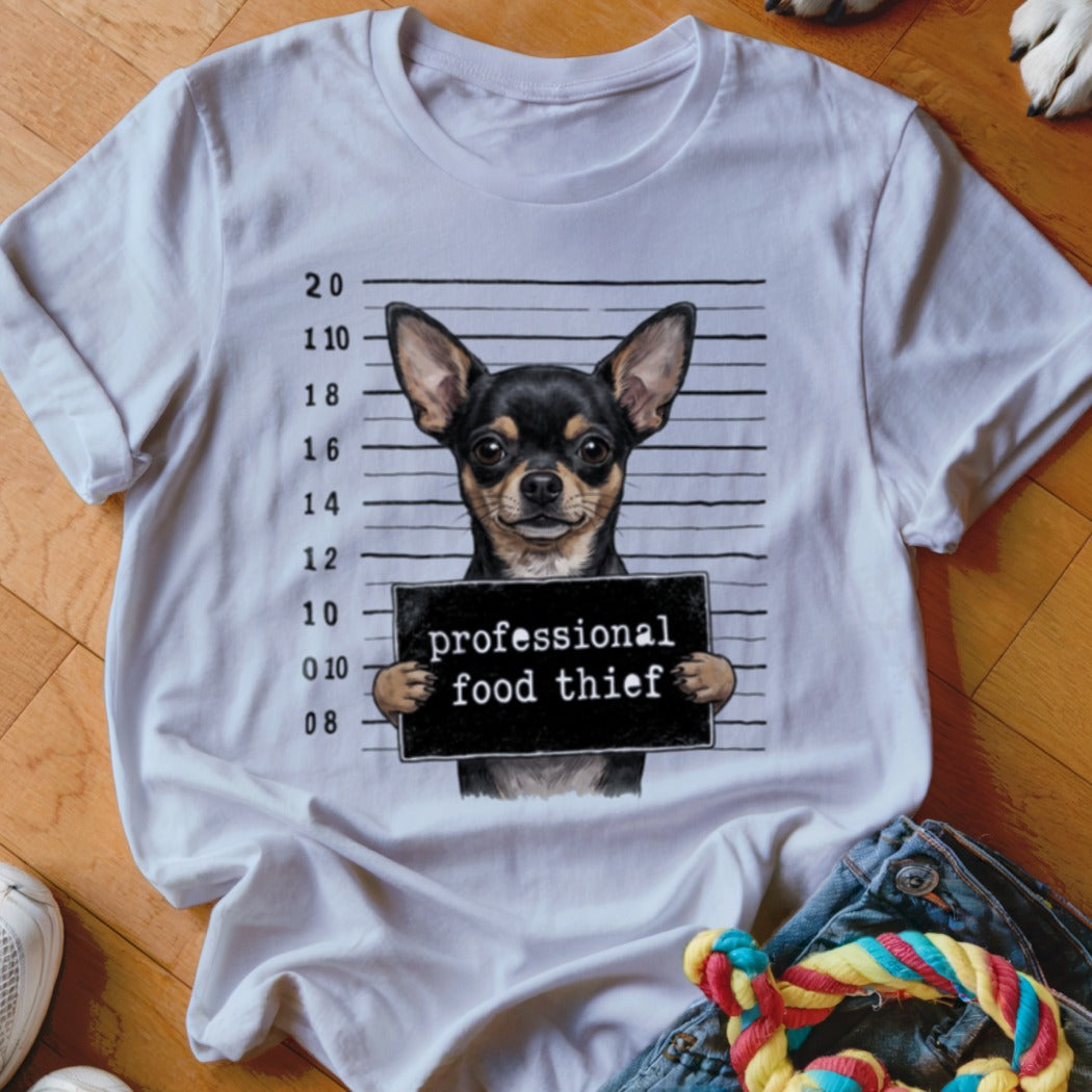 White t-shirt graphic of a chihuahua holding a "professional food thief" sign.
