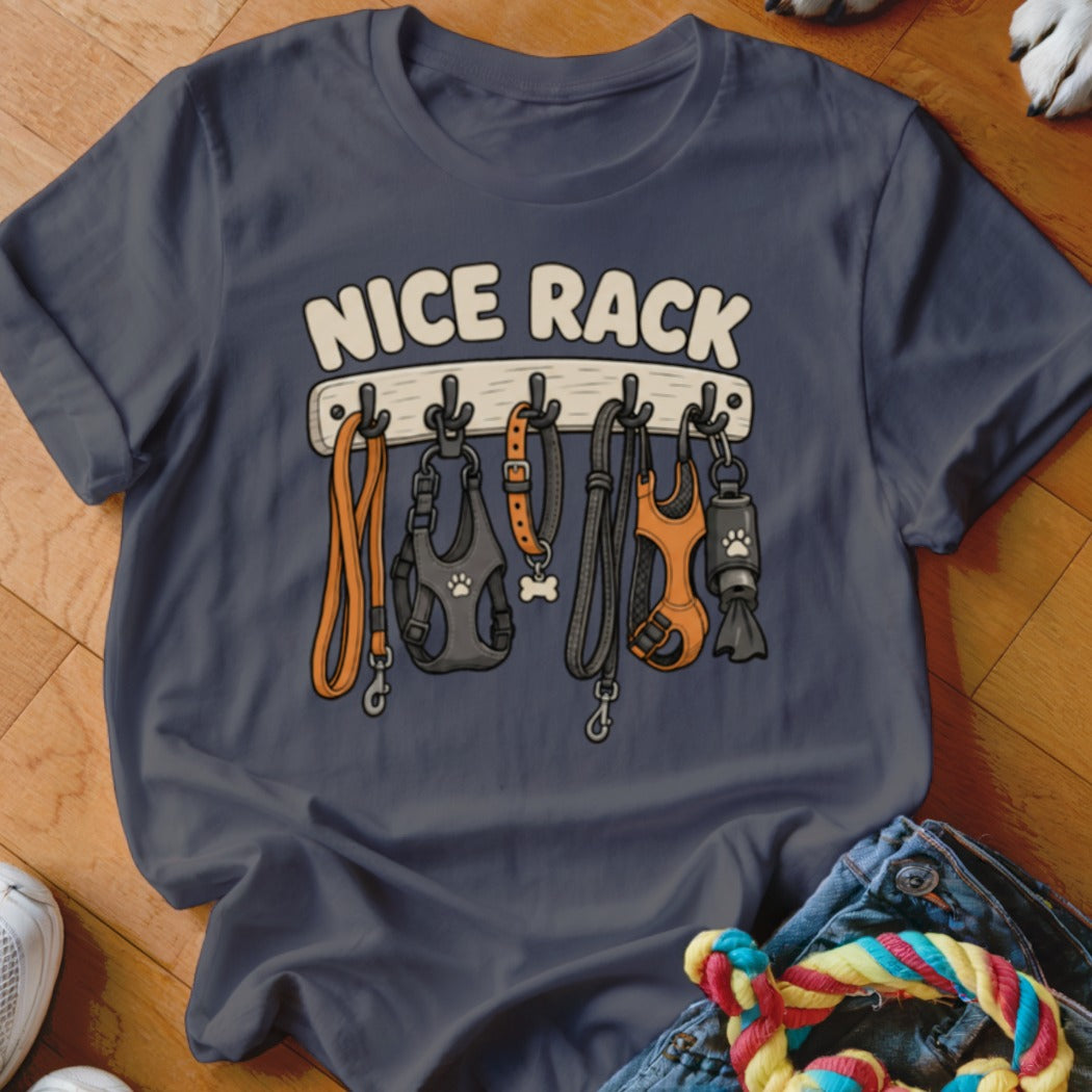 Dark blue t-shirt with "NICE RACK" text and cartoon dog leashes and harnesses hanging on hooks.