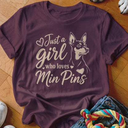 Burgundy t-shirt with "Just a girl who loves Min Pins" and dog illustration.