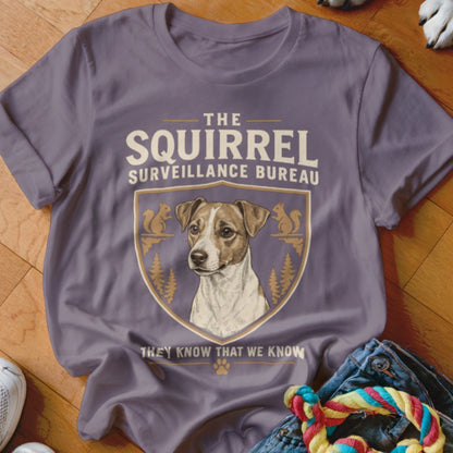 Purple crewneck t-shirt featuring a Jack Russell Terrier graphic and text reading The Squirrel Surveillance Bureau.