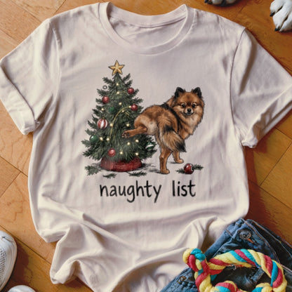 Pomeranian dog peeing on Christmas tree with "naughty list" text.