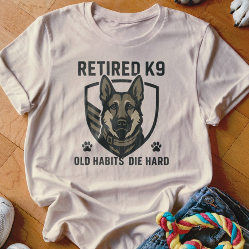 Retired K9 graphic with text "Old Habits Die Hard" on a t-shirt.
