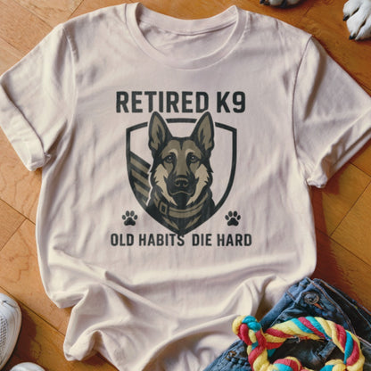 Retired K9 graphic with text "Old Habits Die Hard" on a t-shirt.