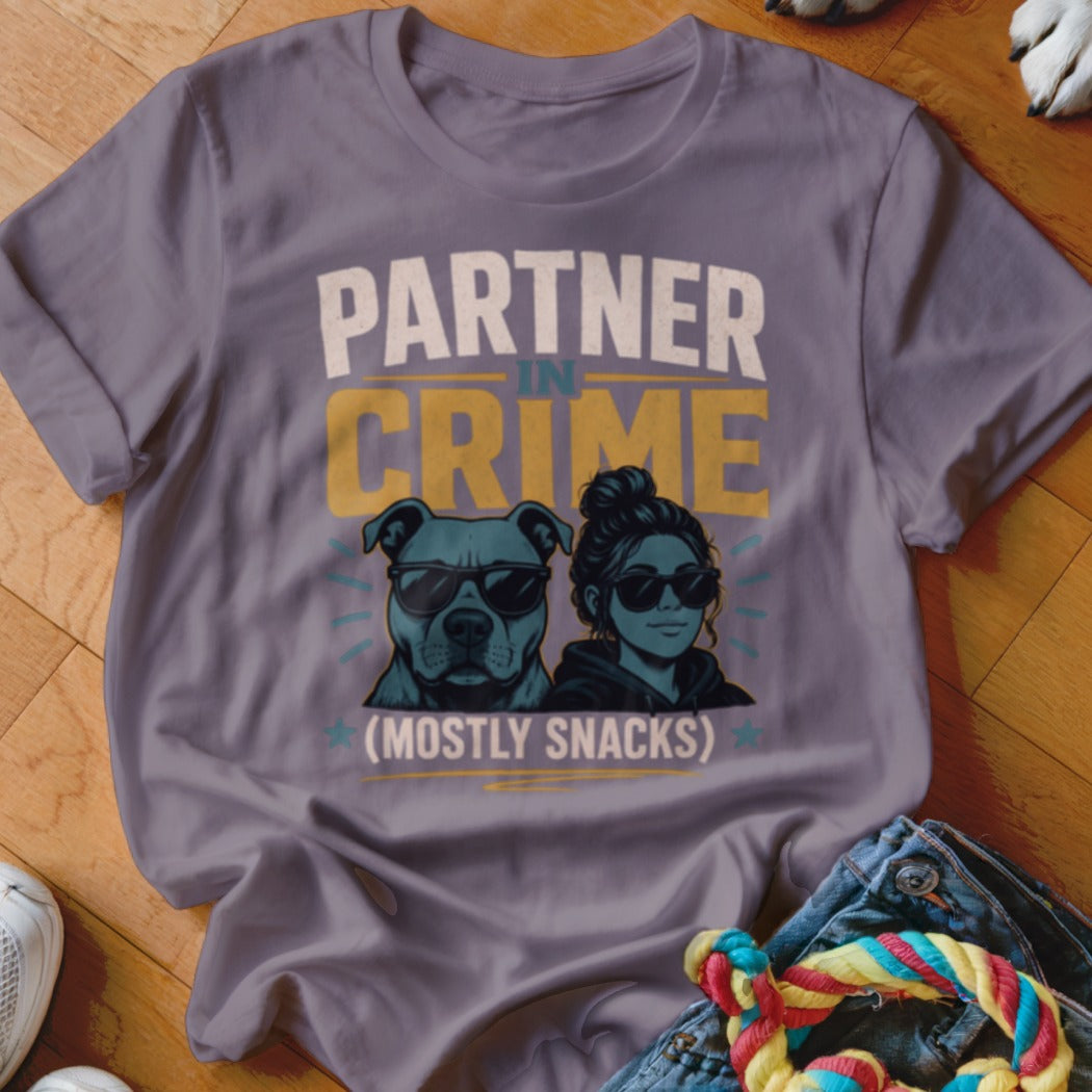 T-shirt graphic displaying "Partner in Crime (Mostly Snacks)" with a dog and woman wearing sunglasses.
