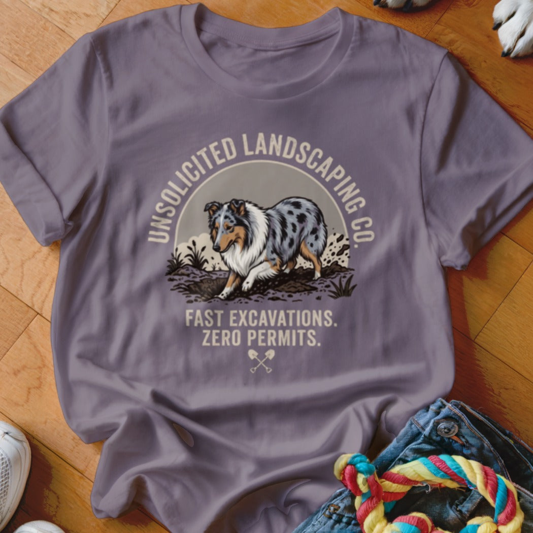 T-shirt with a blue merle dog digging, "Unsolicited Landscaping Co." and "Fast Excavations. Zero Permits."
