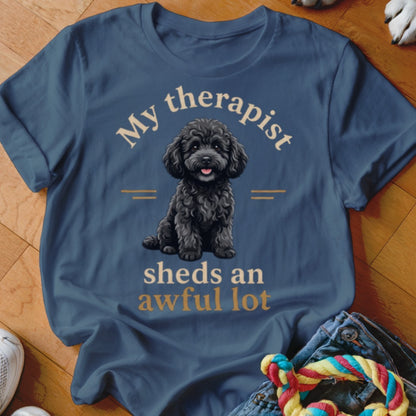 Blue t-shirt with black poodle graphic and text "My therapist sheds an awful lot."