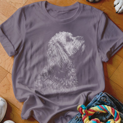 Purple t-shirt with a grey sketched poodle portrait.