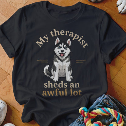 Black t-shirt with a husky graphic and text "My therapist sheds an awful lot".