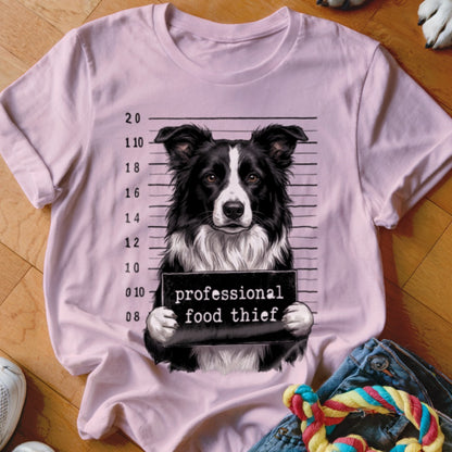 Border collie mugshot with "professional food thief" text on sign.
