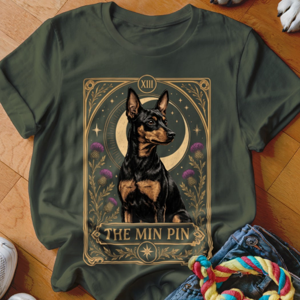 An olive green t-shirt featuring a tarot card graphic of a Miniature Pinscher.