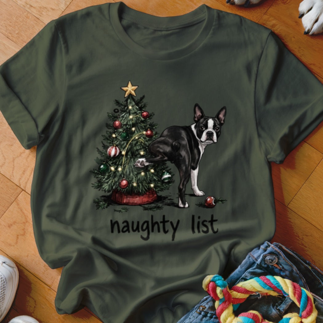 Boston terrier lifting leg on Christmas tree with "naughty list" text.