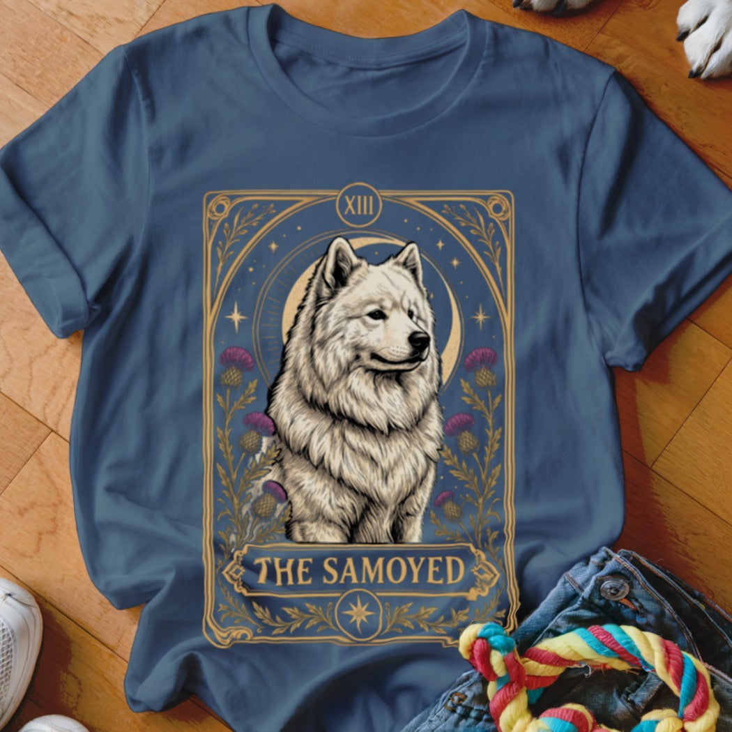 A slate blue crewneck t-shirt featuring a tarot-style graphic of a white Samoyed dog with the text The Samoyed.