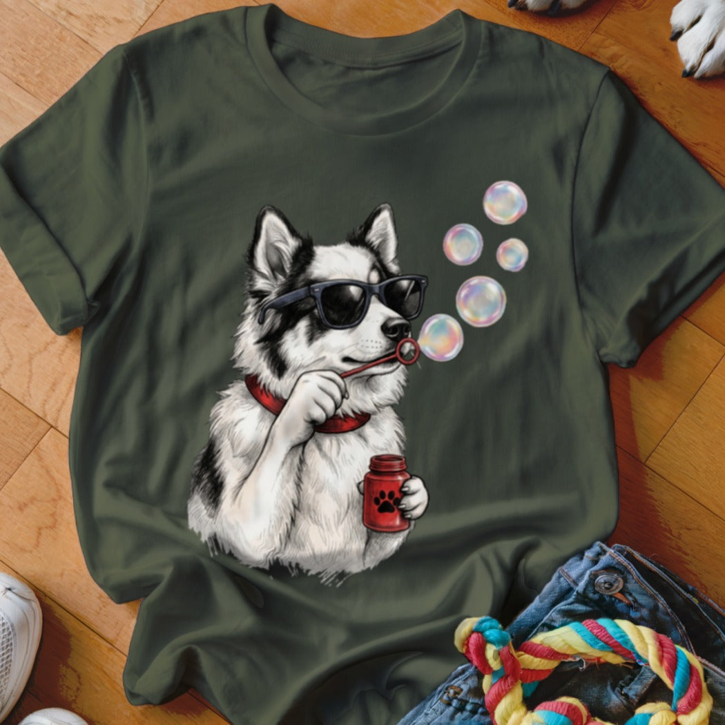 Olive green t-shirt featuring a graphic of a husky wearing sunglasses and blowing bubbles.