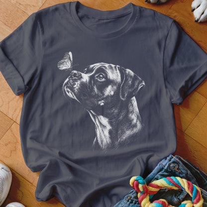 A dark gray t-shirt featuring a white sketch graphic of a boxer dog looking at a butterfly on its nose.
