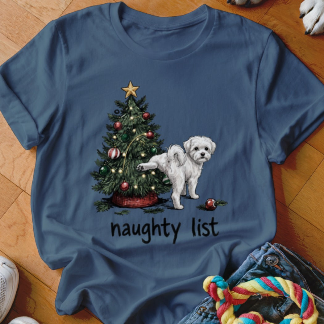 Maltese dog lifting leg on Christmas tree with "naughty list" text.